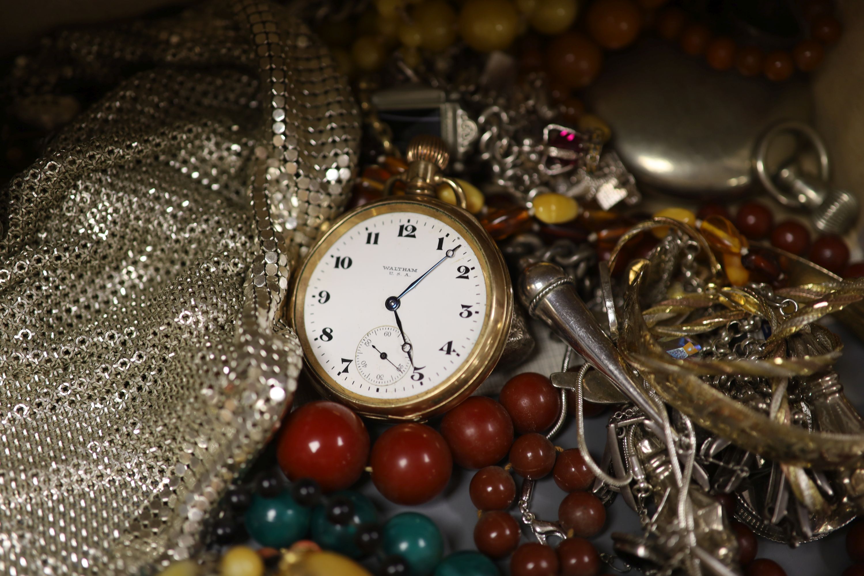 A quantity of mixed jewellery and watches including silver charm bracelet and other silver jewellery, Elgin and Waltham pocket watches, silver condiment etc.